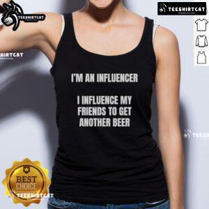 Alt Text: Woman wearing 'Nice I'm an Influencer' tank top, playfully influencing friends to enjoy another beer at a casual gathering.
