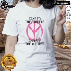 Women wearing 'Nice Take to the Streets and See the Truth' tee, showcasing bold activism and stylish streetwear.