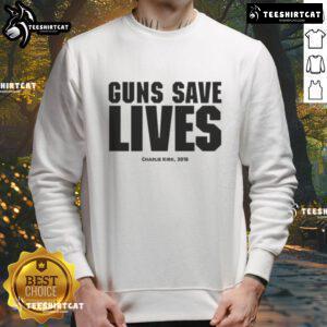 Charlie Kirk wearing a 'Guns Save Lives' sweatshirt at an event, promoting gun rights and conservative values in 2018.