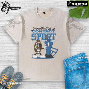 Alt Text: Official Football is a contact sport graphic on a washed t-shirt, showcasing a stylish design for sports enthusiasts.