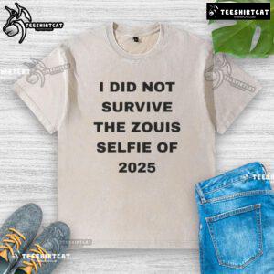 Official I Did Not Survive The Zouis Selfie of 2025 washed t-shirt displayed on a hanger in a trendy boutique.