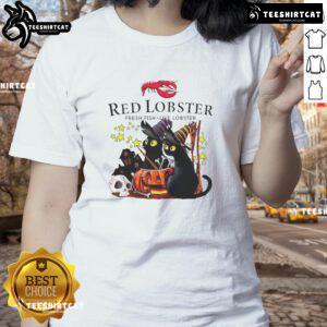 Alt Text: Official Red Lobster Halloween tee featuring a black cat, pumpkin, and haunted house design for ladies.