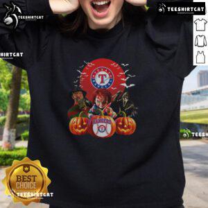 Alt Text: Official Texas Rangers MLB Halloween sweatshirt featuring a spooky design, perfect for horror movie fans and baseball lovers.