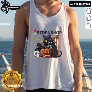 Alt Text: Black cat witch with pumpkin at a haunted house on a Halloween tank top from The Stop And Supermarket.