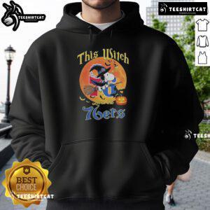 Official This Witch Loves The Philadelphia 76ers Snoopy Halloween Hoodie featuring a whimsical witch and basketball design.