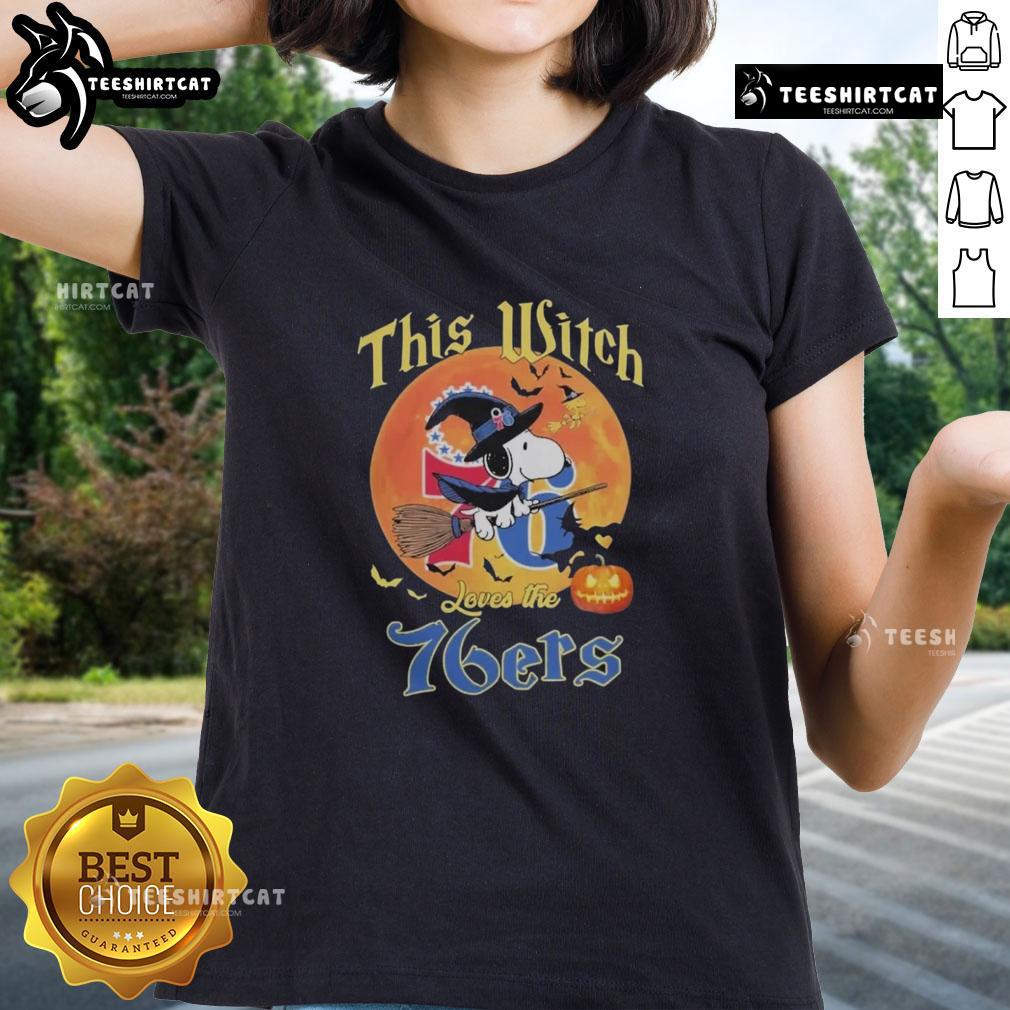 Official This Witch Loves The Philadelphia 76ers Snoopy Halloween Ladies Tee featuring playful witch and basketball design.