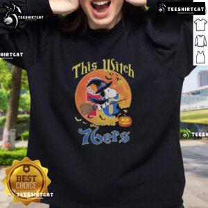 Official This Witch Loves The Philadelphia 76ers Snoopy Halloween Sweatshirt featuring Snoopy in a witch hat and team colors.