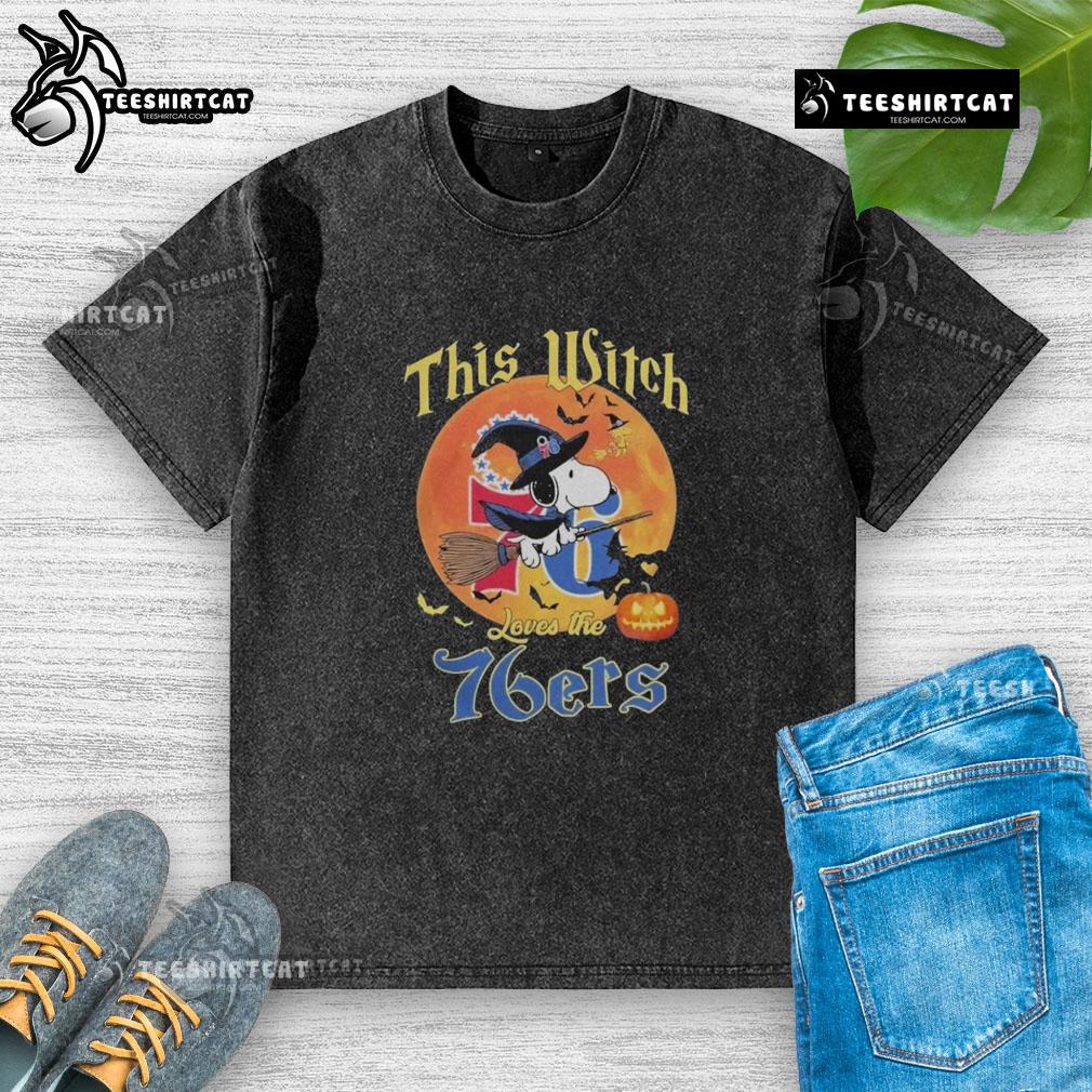 Official This Witch Loves The Philadelphia 76ers Snoopy Halloween T-Shirt in a washed design, perfect for Halloween fans.
