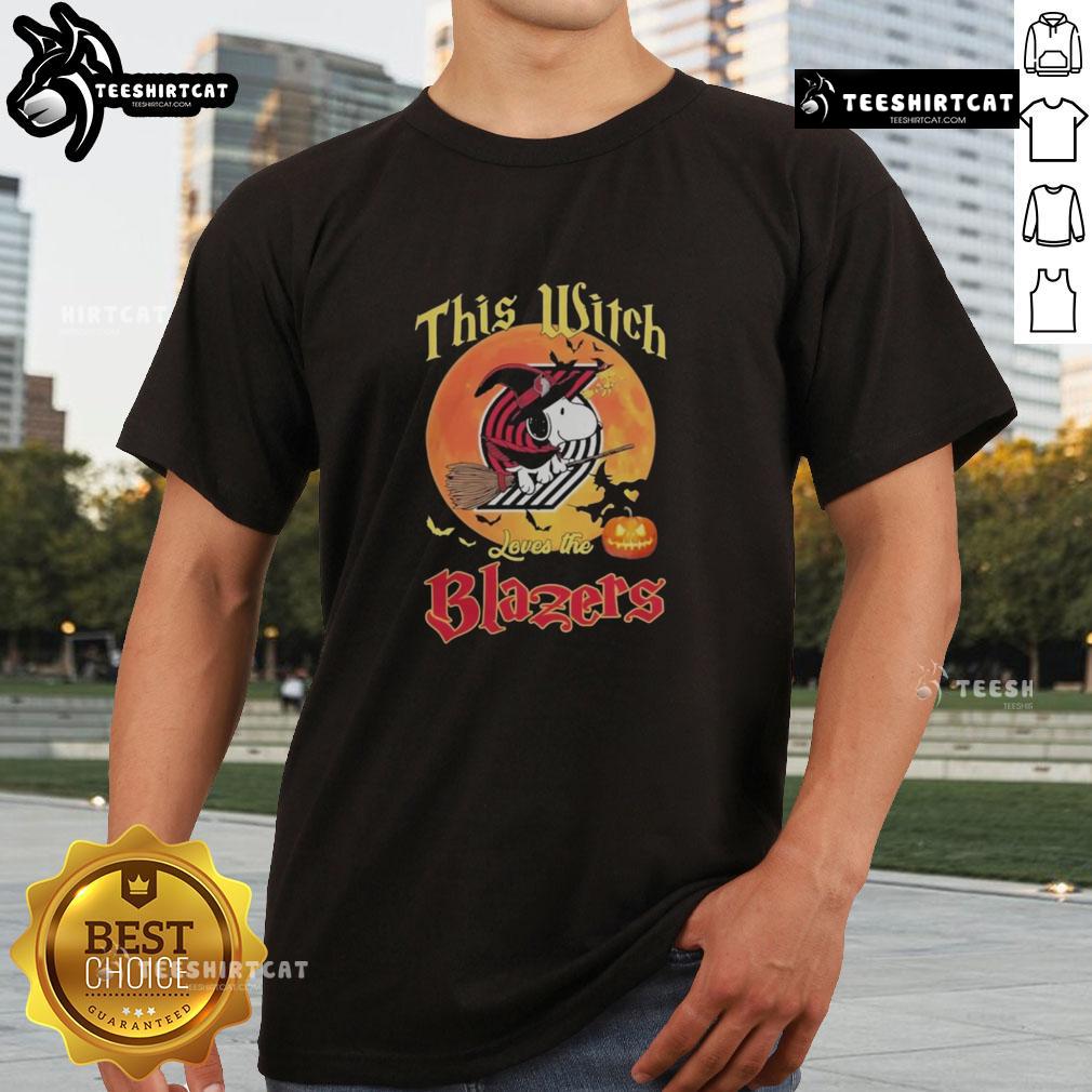 Alt Text: Official This Witch Loves The Portland Trail Blazers Snoopy Halloween T-Shirt featuring a playful design with Snoopy.