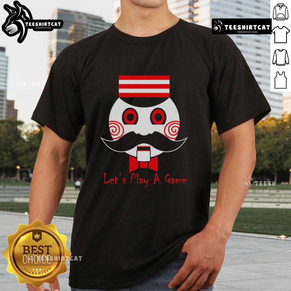 Premium Lets Play A Game Saw Movie T-Shirt featuring horror-themed design and bold graphics for fans.