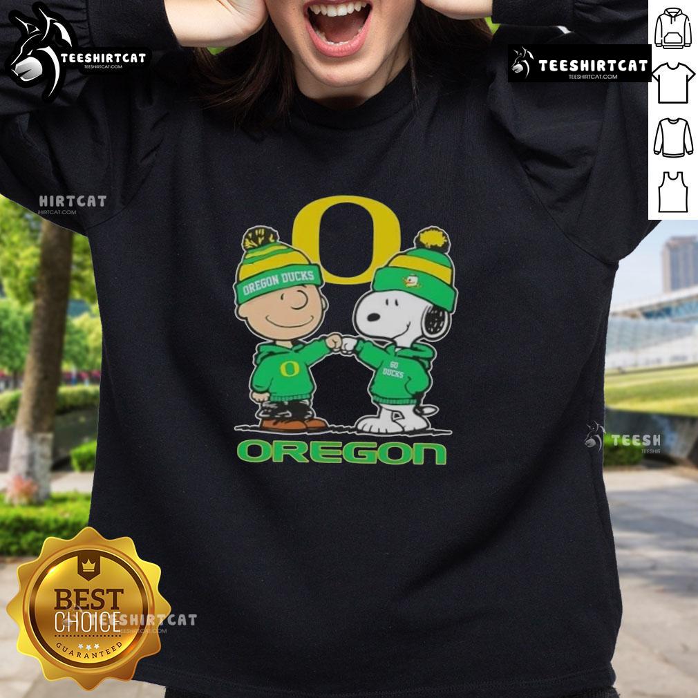 Premium Snoopy and Charlie Brown Oregon Ducks football skyline sweatshirt featuring vibrant graphics and cozy design.