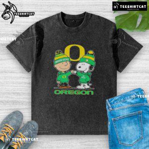 Premium Snoopy and Charlie Brown Oregon Ducks football skyline washed t-shirt, featuring vibrant graphics and soft fabric.
