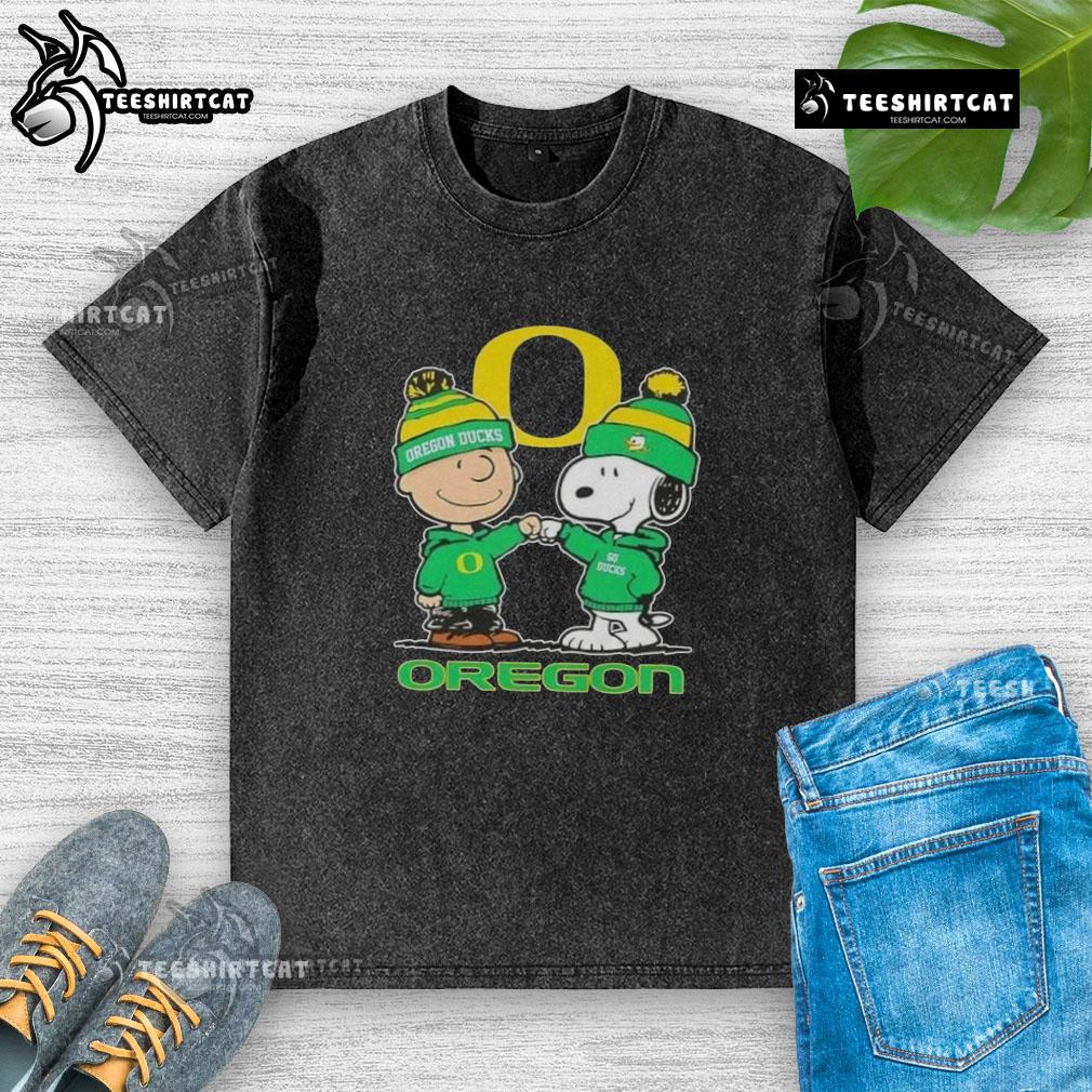 Premium Snoopy and Charlie Brown Oregon Ducks football skyline washed t-shirt, featuring vibrant graphics and soft fabric.