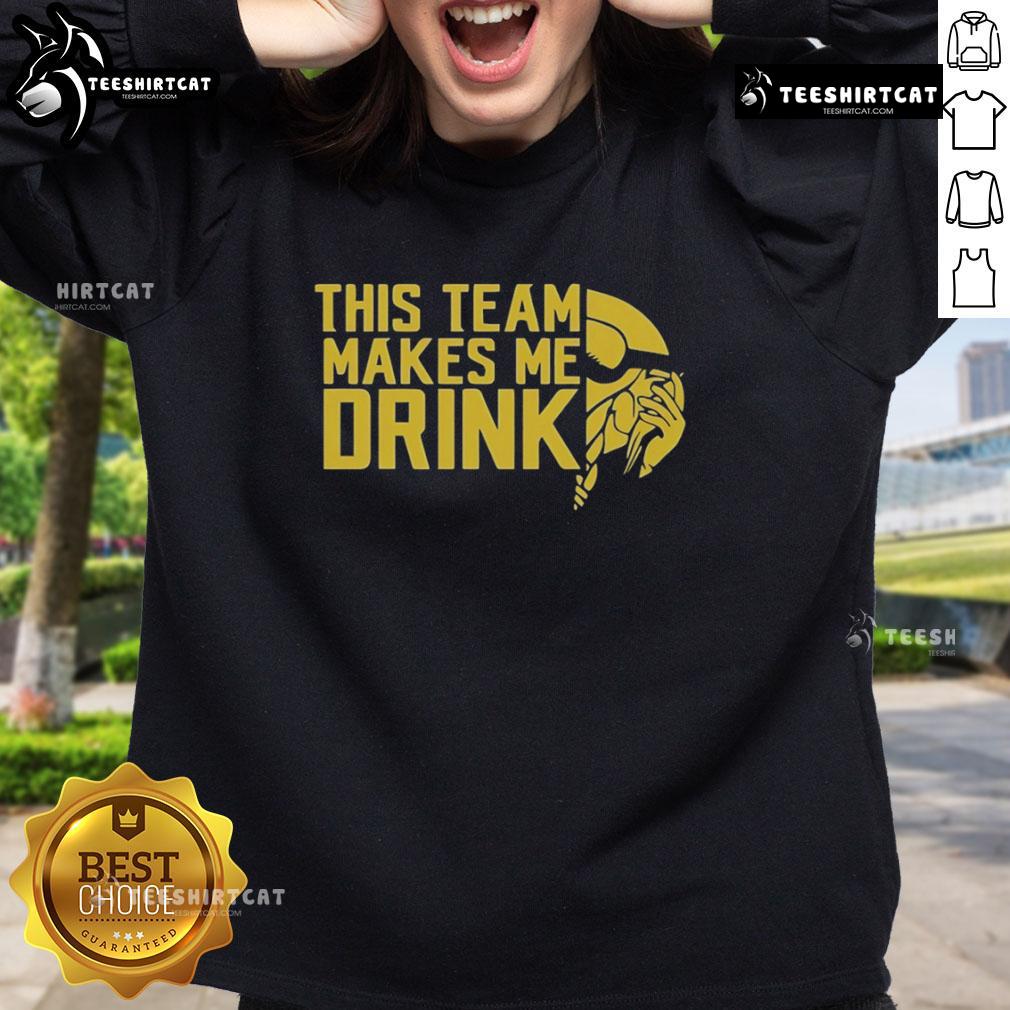 Alt Text: Minnesota Vikings logo sweatshirt from Top This Team Makes Me Drink, showcasing team spirit and style.
