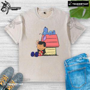 Cute Peanuts Snoopy X Stitch t-shirt featuring 'It Means Nobody Gets Left Behind' design, perfect for casual wear.