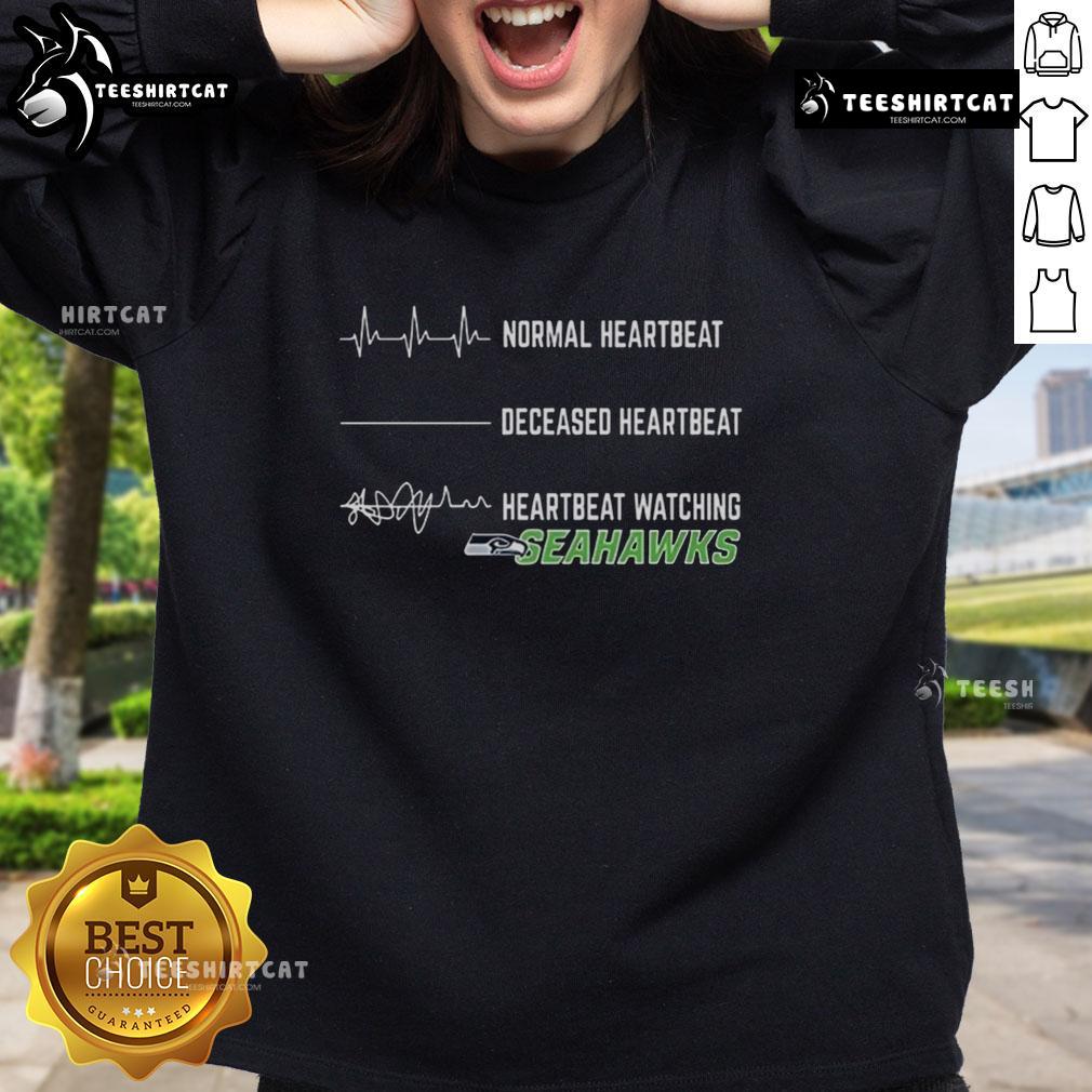 Funny heartbeat design on a Seattle Seahawks sweatshirt, perfect for fans showcasing team spirit and humor.