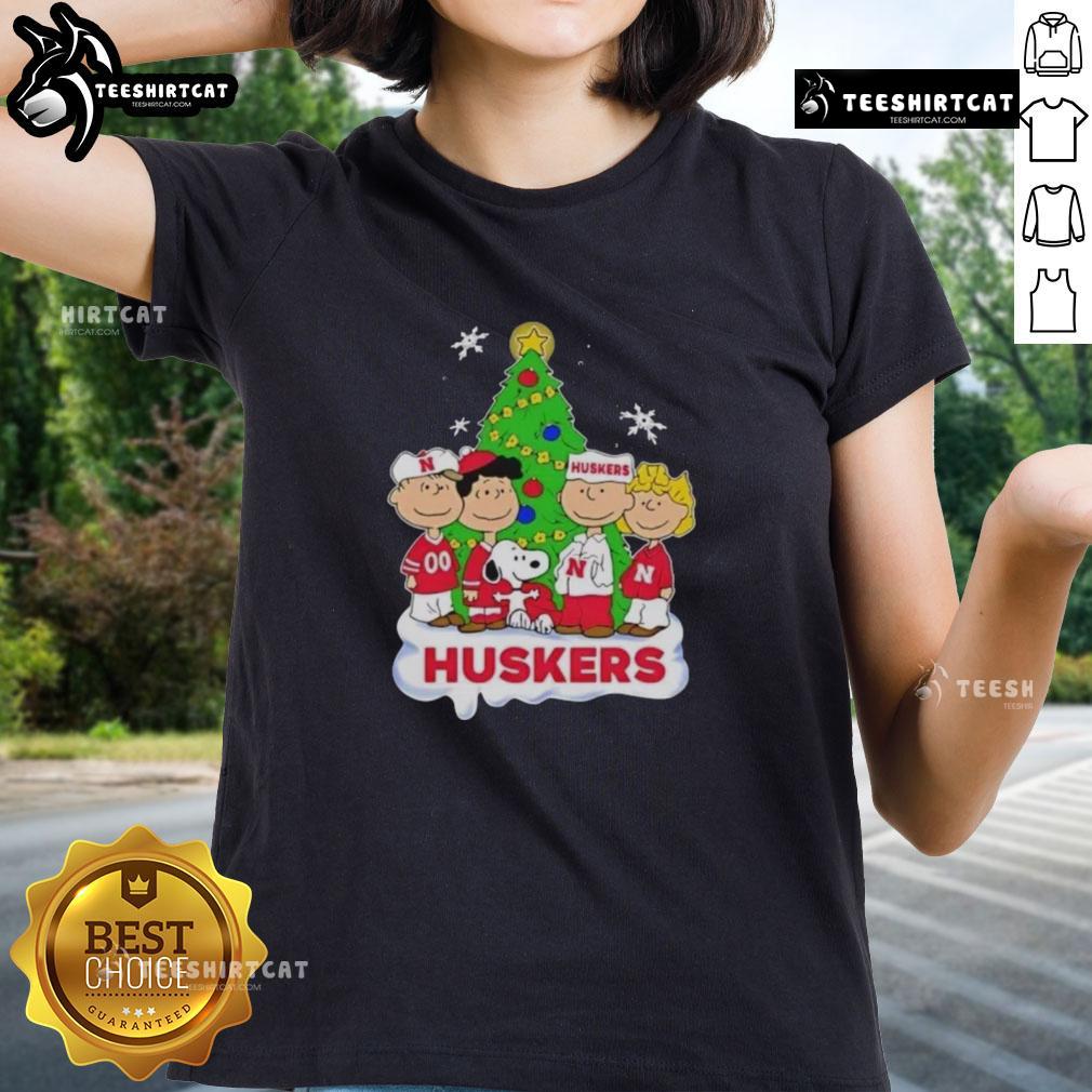 Good Peanuts characters on a Nebraska Cornhuskers Christmas ladies tee, perfect for holiday sports fans.