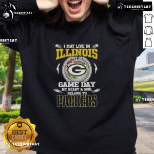 Green Bay Packers sweatshirt with 'Hot I May Live In Illinois But On Game Day My Heart And Soul Belongs To Packers' text.