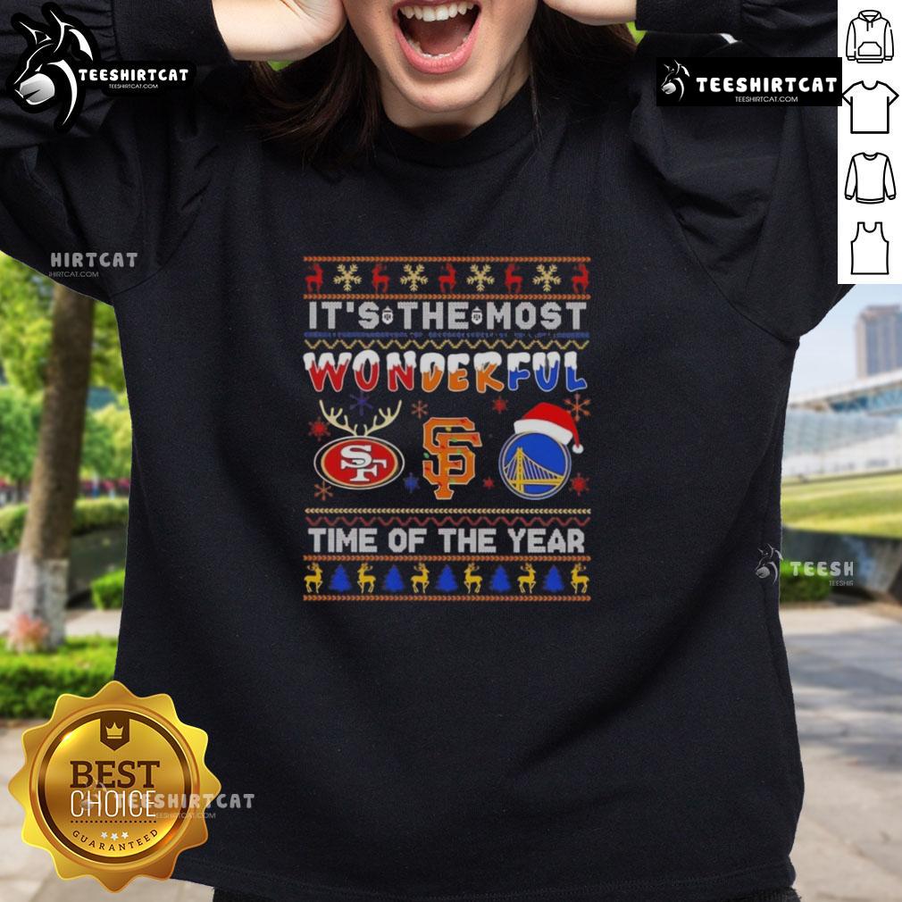 Alt Text: Cozy sweatshirt featuring San Francisco 49ers, Giants, and Warriors logos, perfect for Christmas celebrations.