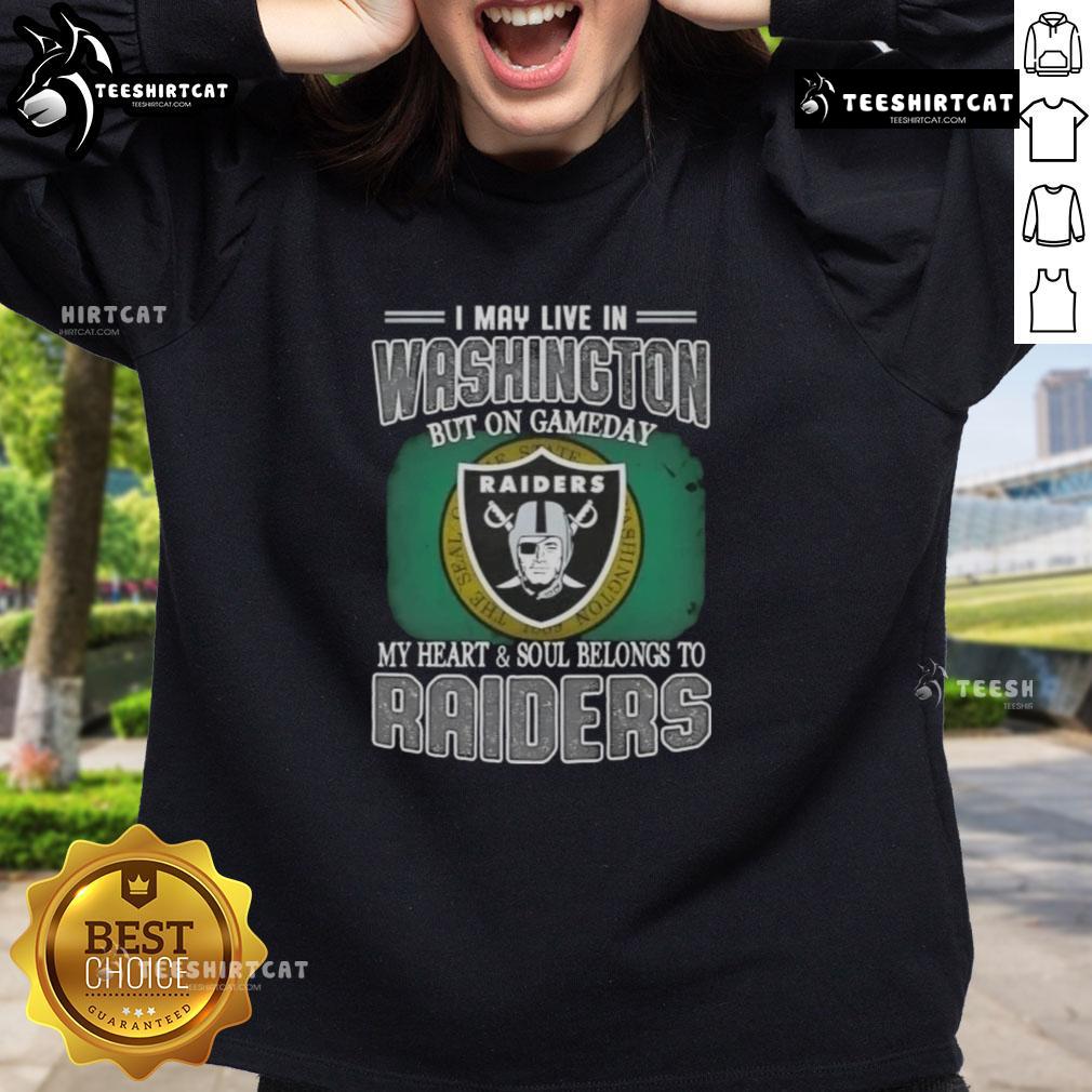 Premium sweatshirt featuring 'I May Live In Washington, But On Gameday My Heart And Soul Belongs To Raiders' design.