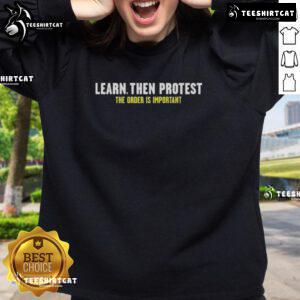 Premium 'Learn Then Protest' sweatshirt featuring a bold design, perfect for advocates passionate about social change.