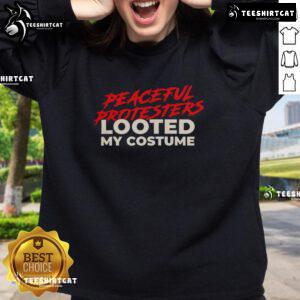 Premium peaceful protesters wearing looted costume sweatshirts at a vibrant demonstration for social justice.