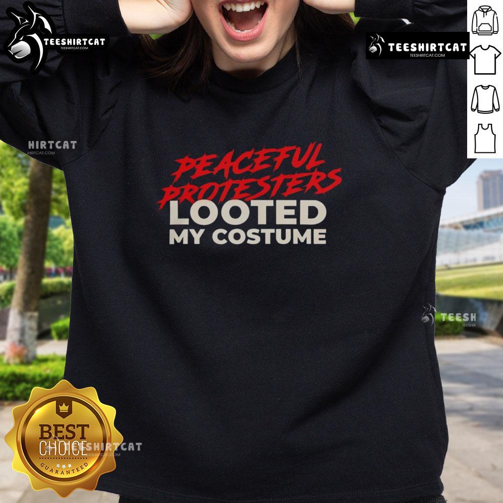 Premium peaceful protesters wearing looted costume sweatshirts at a vibrant demonstration for social justice.