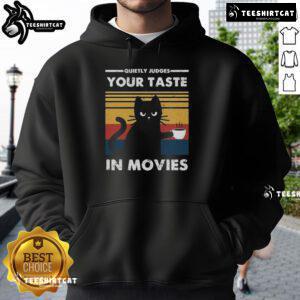 Premium hoodie features 'Quietly Judges Your Taste In Movies' design, perfect for movie lovers and cozy comfort.