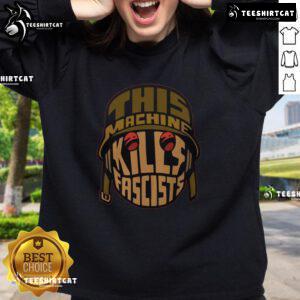 Premium sweatshirt featuring 'This Machine Kills Fascists' slogan, perfect for bold activists and fashion-forward individuals.