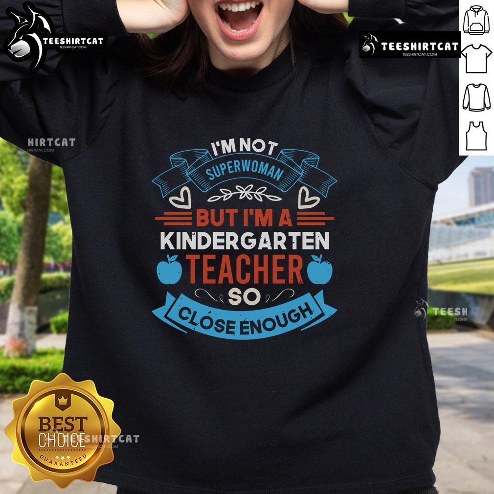 Cozy sweatshirt reading 'I'm Not Superwoman, But I'm A Kindergarten Teacher' perfect for educators and fans of teaching.