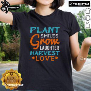 Pretty Plant Smiles Grow Laughter Harvest Love Ladies Tee showcasing vibrant floral design and cheerful message.