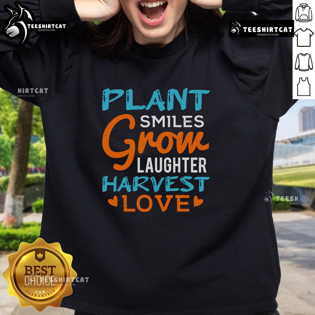 Alt Text: Cozy sweatshirt featuring 'Pretty Plant Smiles Grow Laughter Harvest Love' design, perfect for plant lovers and positivity.
