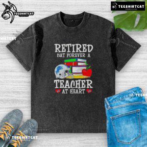 Pretty retired but forever a teacher at heart Detroit Lions football washed t-shirt in a casual setting.