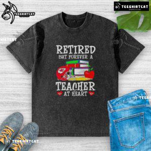 Pretty retired but forever a teacher at heart Kansas City Chiefs football washed t-shirt displayed on a hanger.
