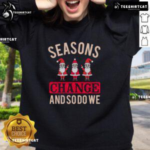 Cozy Christmas sweatshirt featuring seasonal change design, perfect for celebrating the holidays in style.