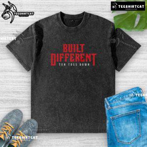 Top Built Different Ten Toes Down washed t-shirt displayed on a hanger, showcasing its casual style and soft fabric.