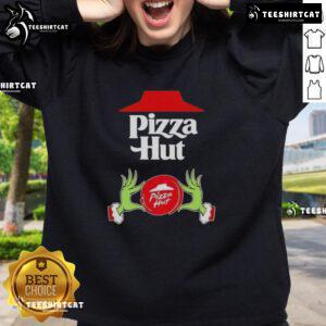Top Grinch hands holding a pizza slice on a Merry Christmas Sweatshirt from Pizza Hut, perfect for festive celebrations.