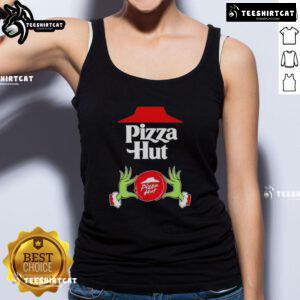 Top Grinch hands holding a pizza slice in a festive Pizza Hut tank top for Merry Christmas celebration.