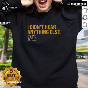 Brice Turang wearing a Milwaukee Brewers sweatshirt with 'I Didn't Hear Anything Else' slogan at a game.