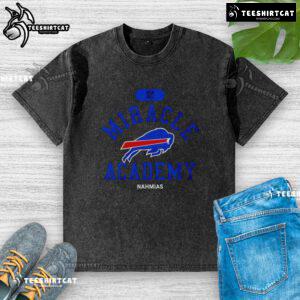 Buffalo Bills Miracle Academy Nahmias Washed T-Shirt displayed on a hanger, showcasing vibrant colors and team spirit.