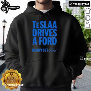 Person wearing a 'Top Tesla Drives a Ford' hoodie, showcasing a fun automotive-themed graphic and stylish design.