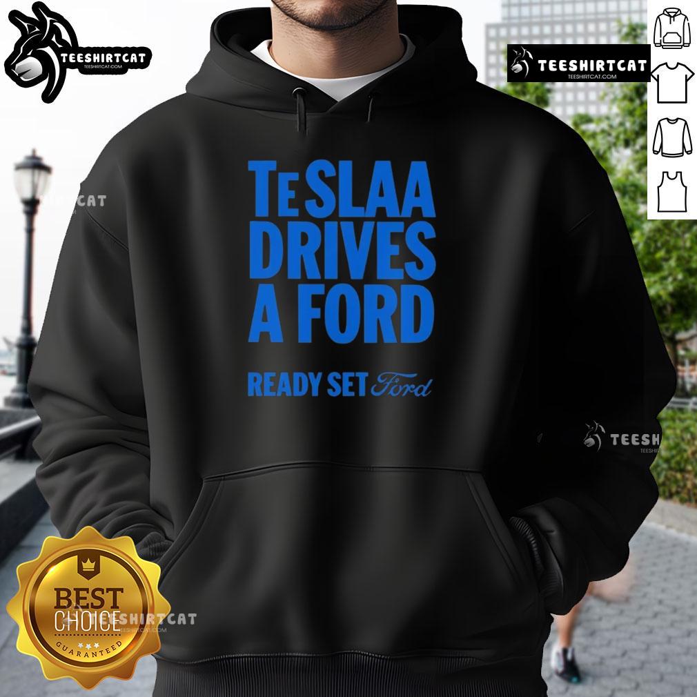 Person wearing a 'Top Tesla Drives a Ford' hoodie, showcasing a fun automotive-themed graphic and stylish design.