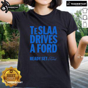 Top Tesla drives a Ford in a fun 'Ready Set Ford' ladies tee, showcasing a playful automotive theme.