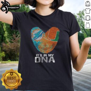 Official Miami City Sports Dolphins X Hurricanes ladies tee featuring 'It's In My DNA' design with heart and fingerprint.