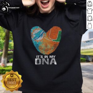 Alt Text: Official Miami City Sports Dolphins X Hurricanes sweatshirt featuring It's In My DNA graphic on heart design.