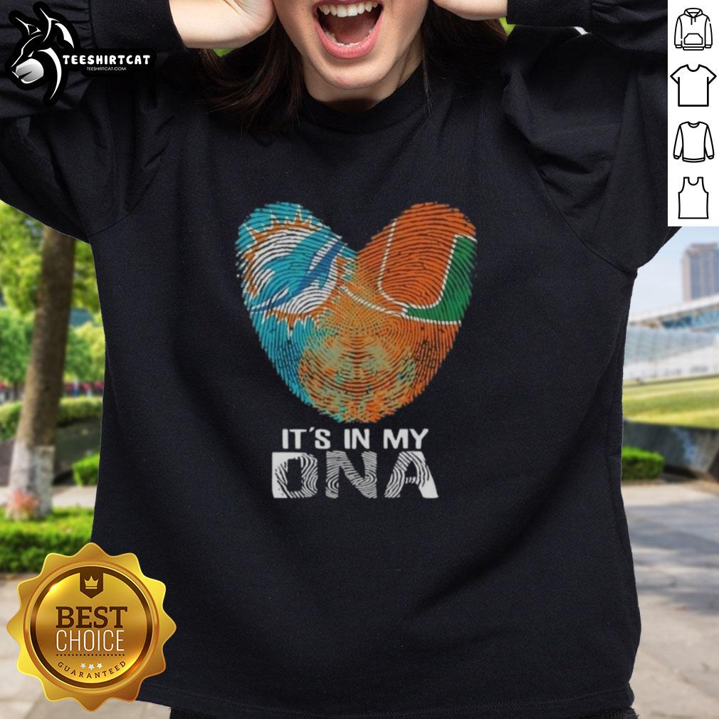 Alt Text: Official Miami City Sports Dolphins X Hurricanes sweatshirt featuring It's In My DNA graphic on heart design.