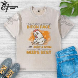 Alt Text: Cute rooster graphic on a relaxed-fit t-shirt featuring the phrase I don't have a resting bitch face, I need rest.