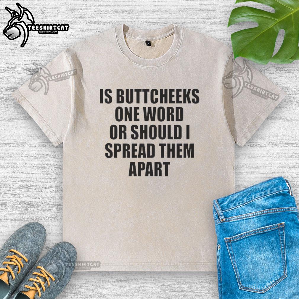 Good Is Buttcheeks washed t-shirt design featuring playful text, perfect for casual wear and humor enthusiasts.