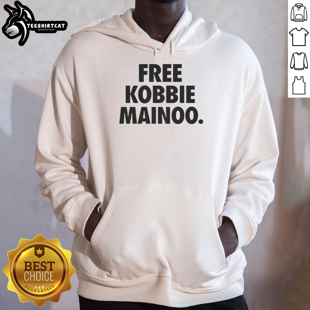 Happy man wearing Free Kobbie Mainoo hoodie, celebrating his brother Kobbie Mainoo's achievements in football.