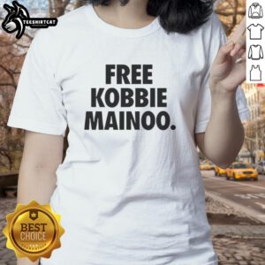 Happy man united's Mainoo's brother wearing Free Kobbie Mainoo ladies tee, showcasing team spirit and style.
